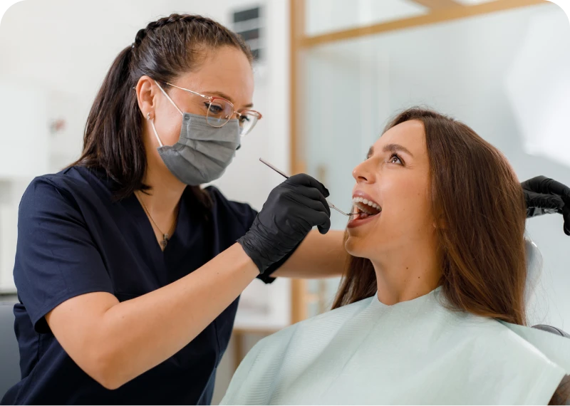 Dental professional with patient in clinic