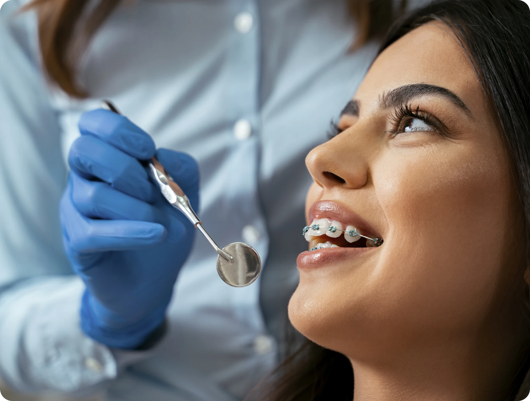Woman with braces at dental checkup