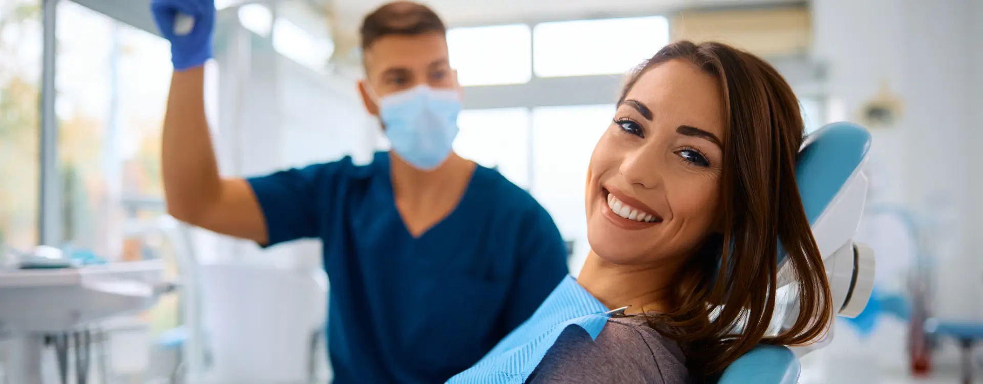 Woman smiling during dental check-up.